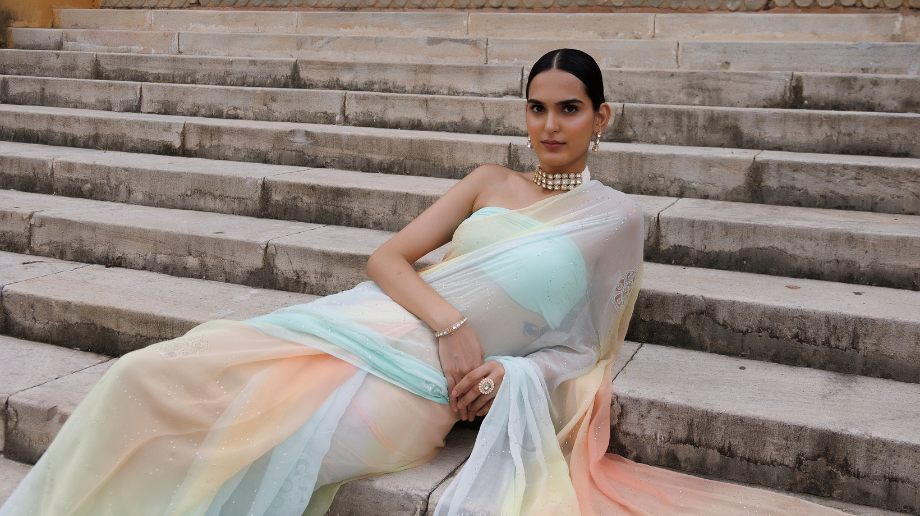 Elegant pastel saree with multicolour drape styled on a model