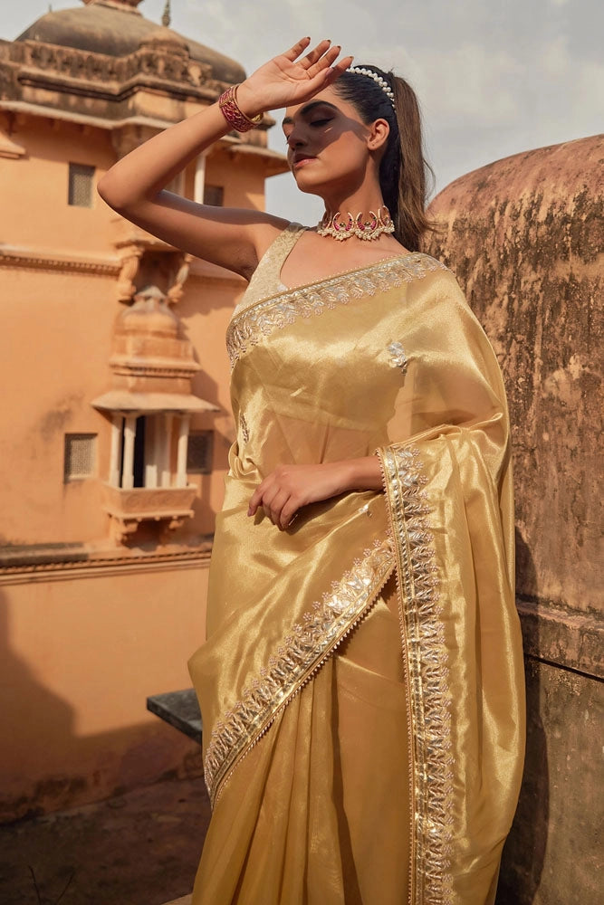 Golden Tissue Saree Adorned with Gota Patti and Pearl Embellishments