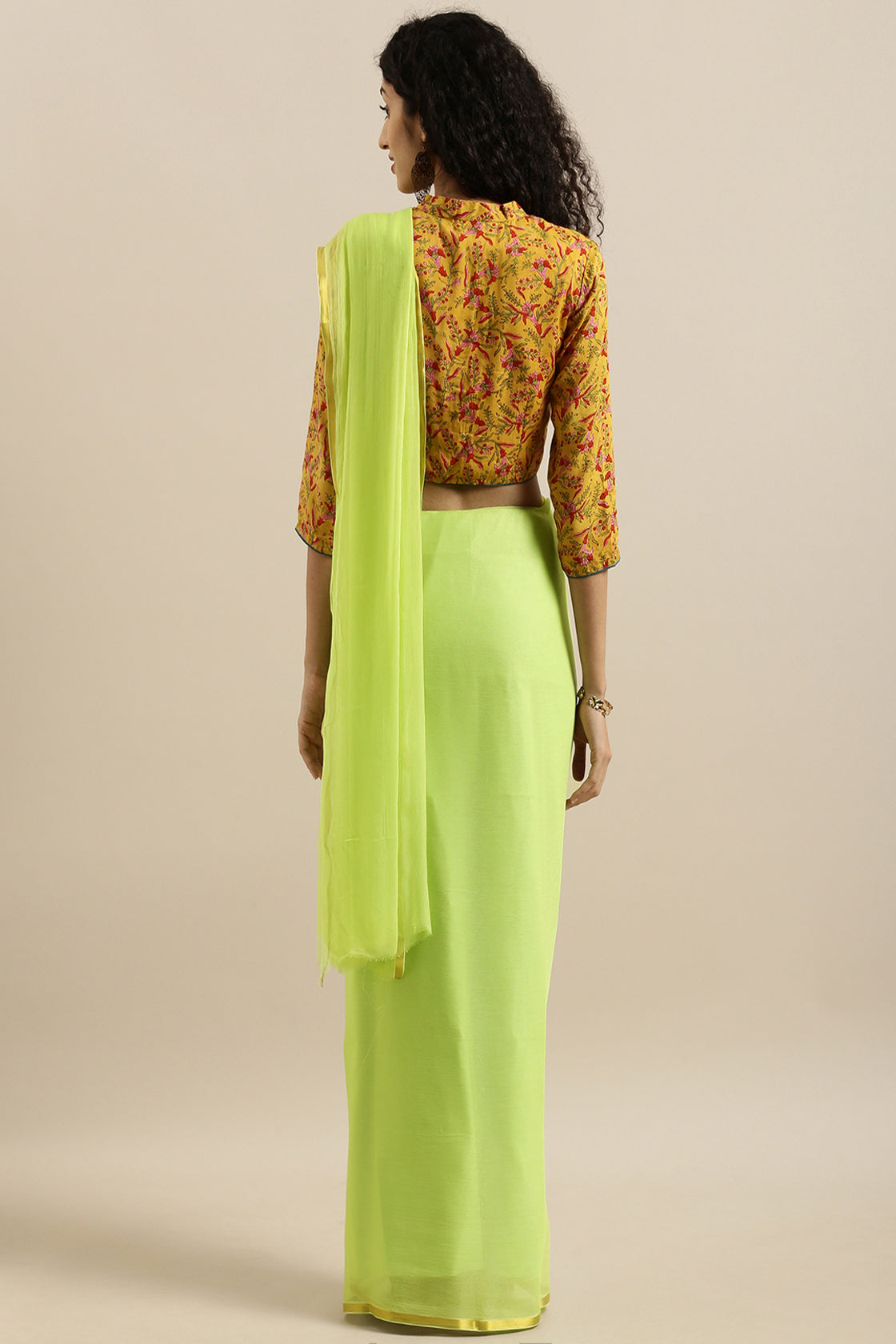 Malavika Mohanan In Lime Green Hand-Dyed Plain Chiffon Saree With Hand Block Printed Blouse