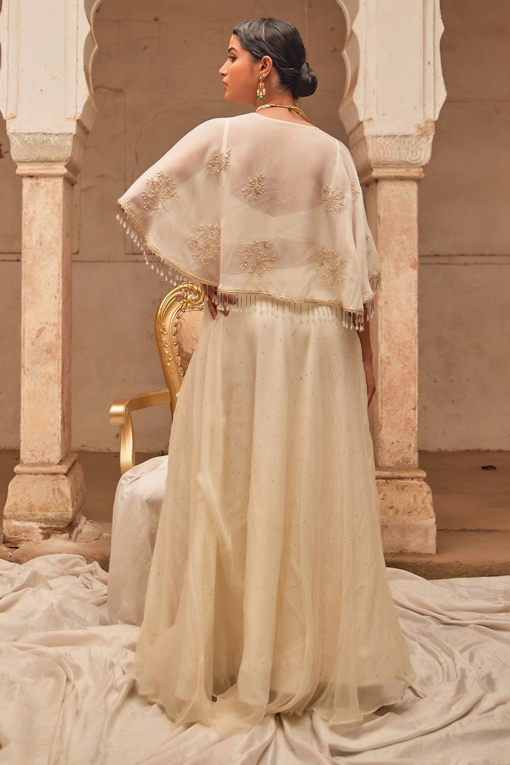 Off White Chiffon Mukaish Lehenga with White Hand Embroidered Cape
