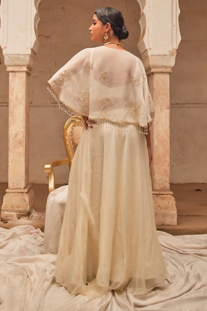 Off White Chiffon Mukaish Lehenga with White Hand Embroidered Cape