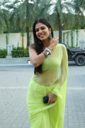 Malavika Mohanan In Lime Green Hand-Dyed Plain Chiffon Saree With Hand Block Printed Blouse
